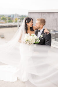 "Best luxury wedding photographer capturing candid moments during an elegant wedding ceremony"