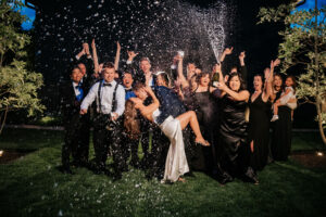 Guests celebrating on the dance floor during a high-energy wedding reception
